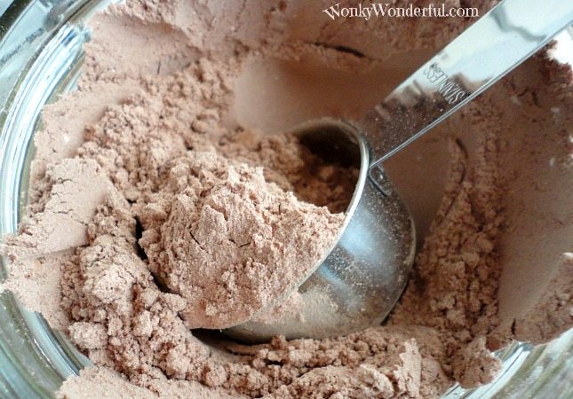 closeup of metal scoop in cocoa mix