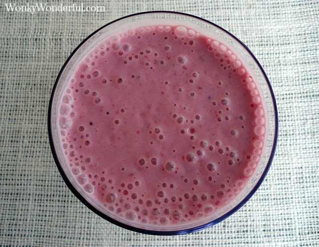 deep pink mixture in container with bubbles on top