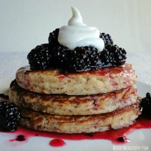 almond pancakes with blackberry syrup and sweet yogurt cream