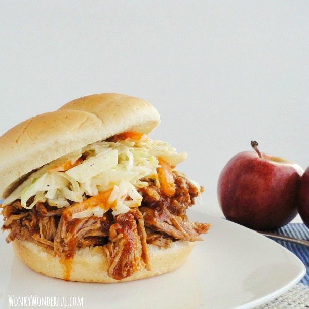 bbq pulled pork and slaw on bun, apple on the side