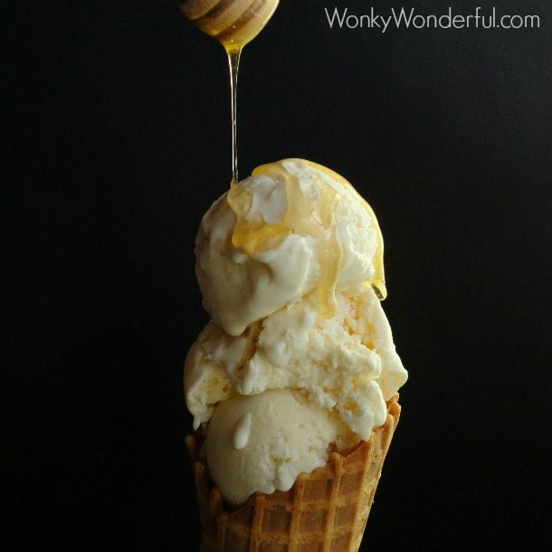 honey being drizzled over creamy ice cream in waffle cone