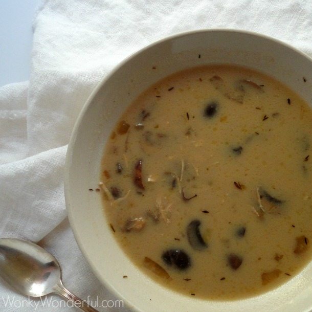 beige bowl filled with light brown soup