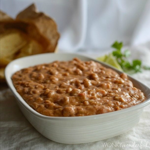 white serving dish filled with beans