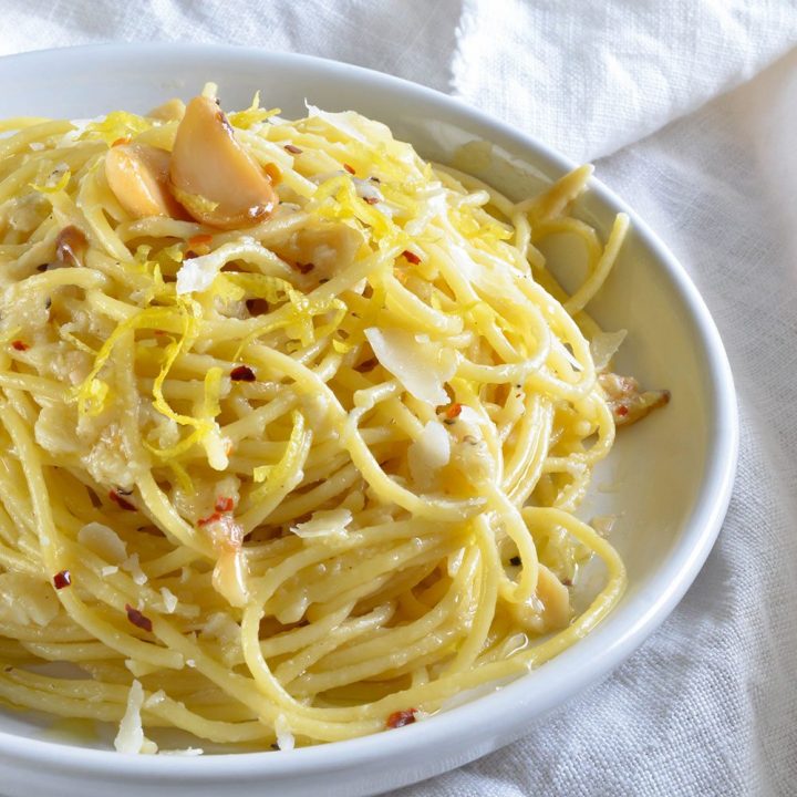 Lemon Garlic Pasta Recipe - A simple dinner idea or filling side dish. Pasta tossed with lemon, premium olive oil, red pepper flakes, parmesan cheese and roasted garlic.