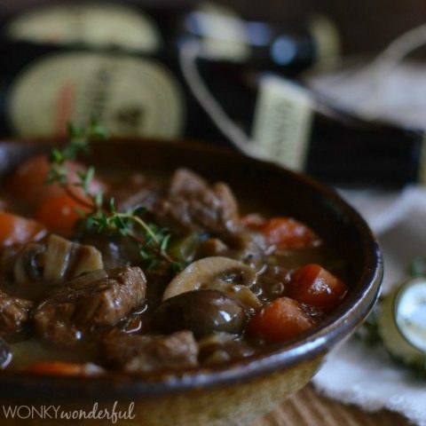 closeup of beef stew in brown bowl