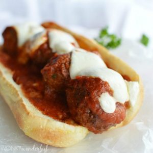 French roll topped with meatballs, marinara and melted mozzarella