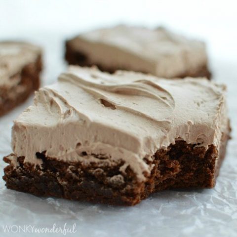 frosted chocolate brownie on wax paper