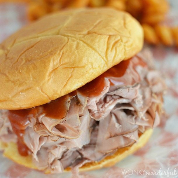 soft bun filled with thinly sliced roast beef and dripping dark red sauce