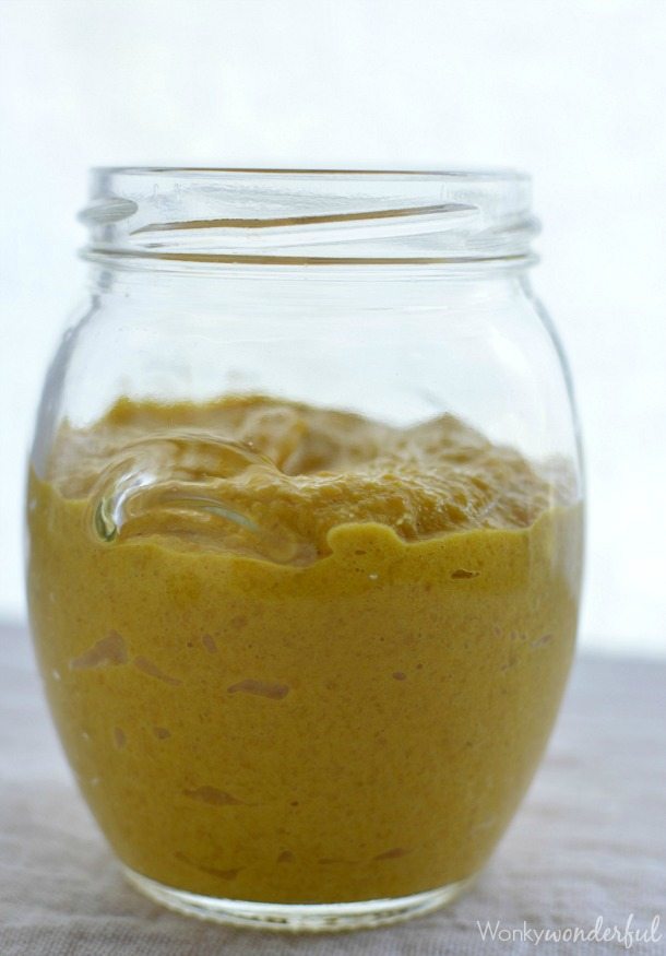 clear jar with yellow mustard inside