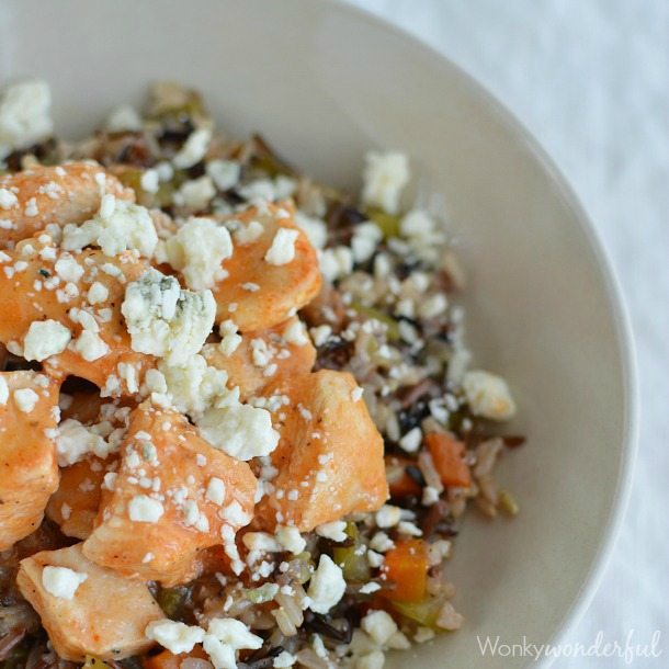 rice and veggies topped with chicken and blue cheese crumbles