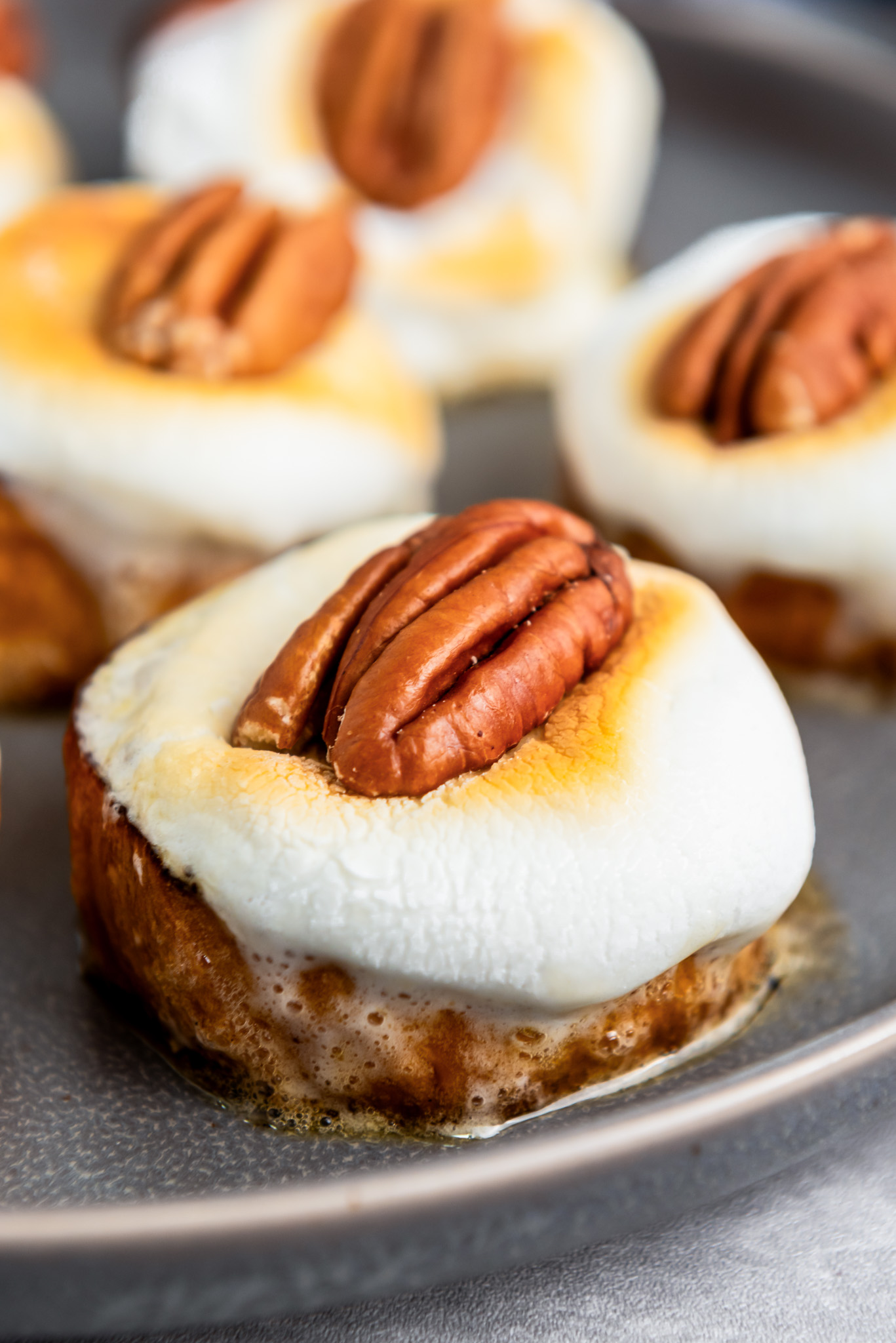 sweet potato slices topped with melted marshmallow and pecan
