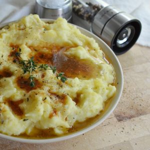 Best Mashed Potatoes Recipe - Creamy mashed potatoes with thyme infused brown butter. A super easy yet impressive side dish that is perfect for the holidays!