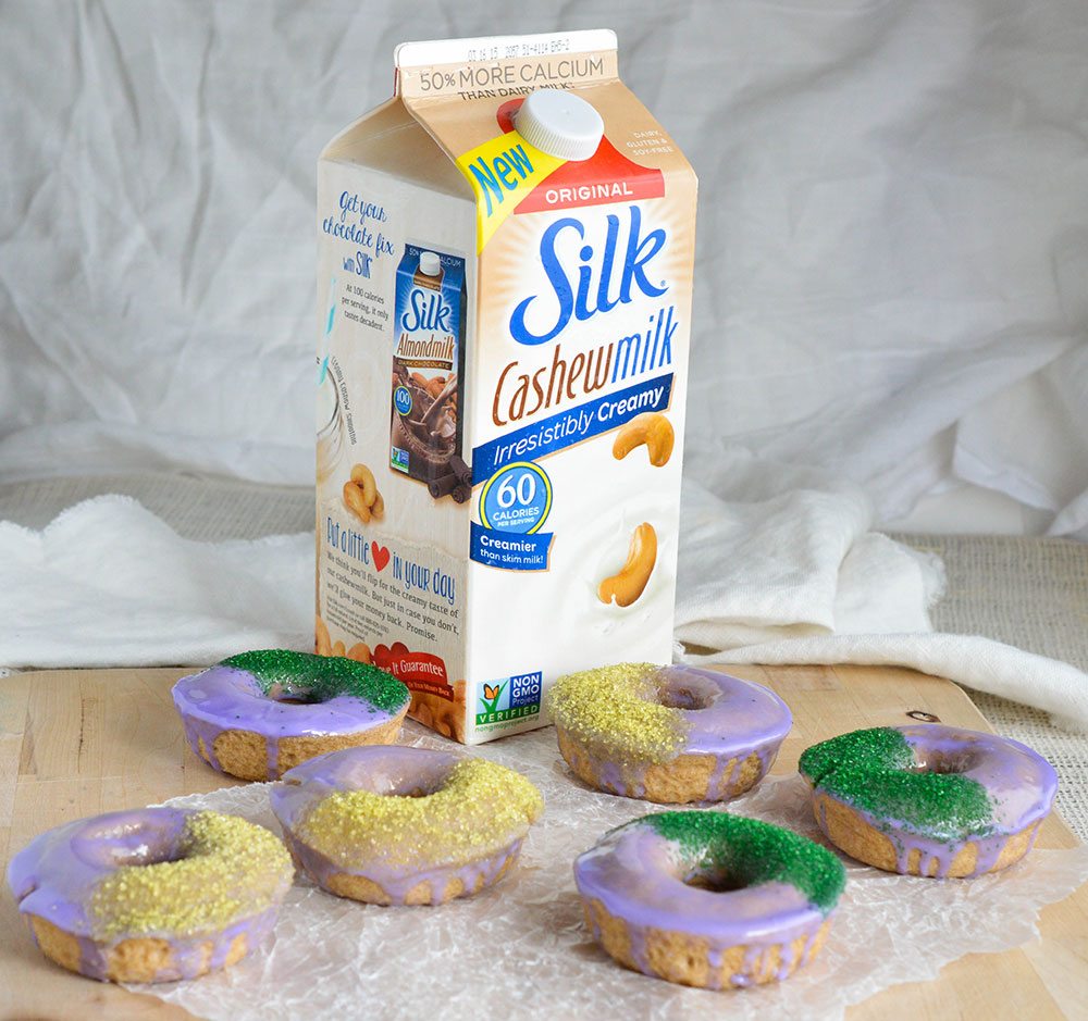 Baked Cinnamon Doughnuts decorated like a Mardi Gras King Cake! Make these cake donuts for a fun breakfast! Dairy Free Recipe