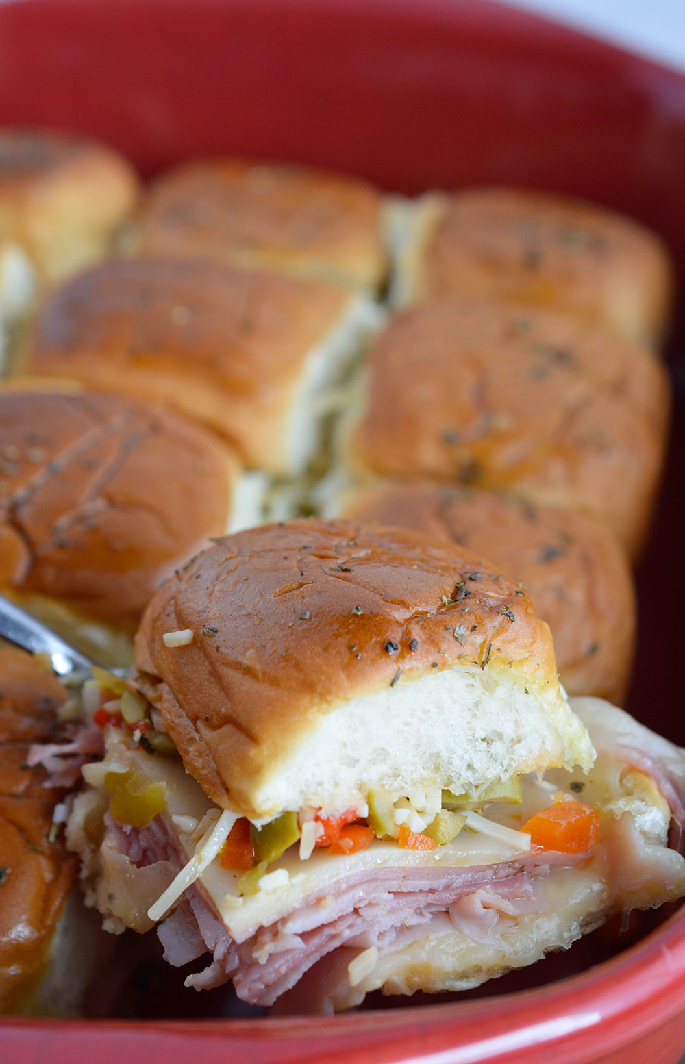 Muffalata Oven Baked Sandwiches - This Italian Sandwich is loaded with meat, cheese and olive salad. A New Orleans favorite, baked in the oven and perfect for feeding a crowd!