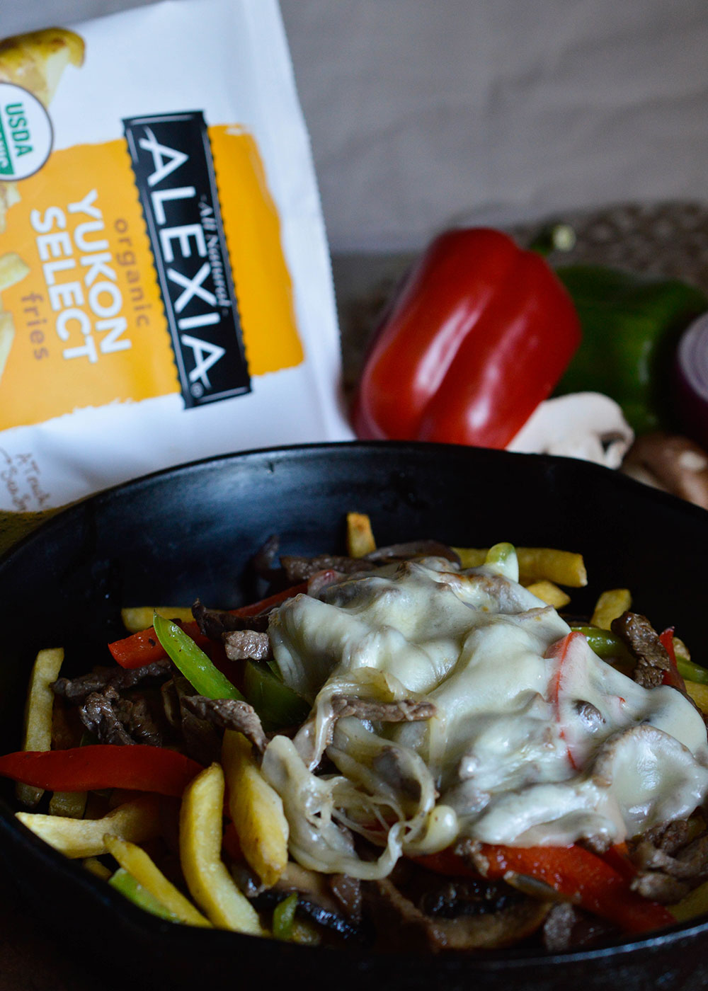 Philly Cheese Steak Fries Recipe. All of the delicious flavors of a Philly Cheesesteak Sandwich served over crisp french fries! Peppers, Mushrooms, Cheese and Steak. This makes a great party food or dinner!