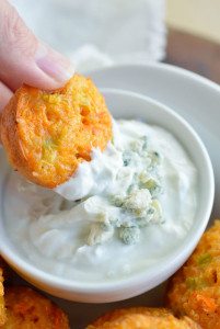 Quinoa Buffalo Bites have all the flavor of buffalo wings but are low fat and low calorie. This gluten free appetizer recipe is perfect for game day or parties! Baked quinoa bites with blue cheese Greek yogurt dipping sauce.