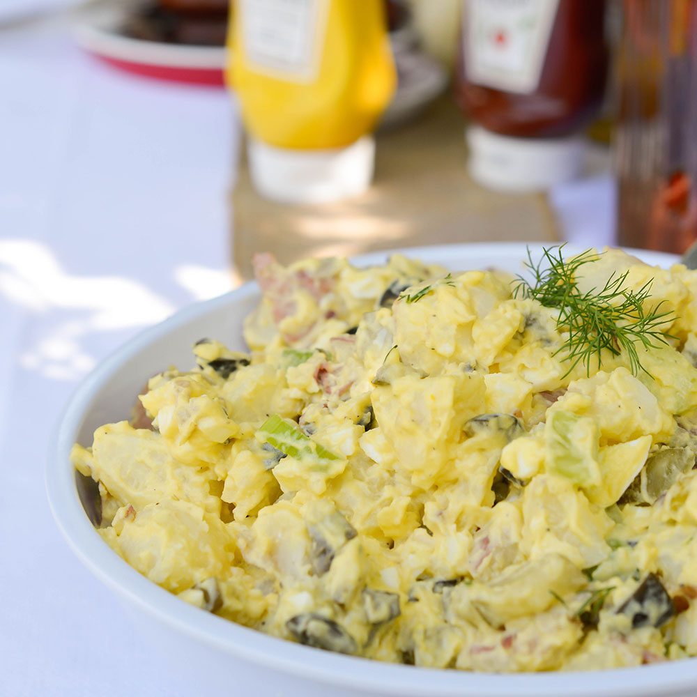 Enjoy this Classic Potato Salad Recipe at your next family barbeque. A creamy traditional potato salad that is the ultimate summertime comfort food!
