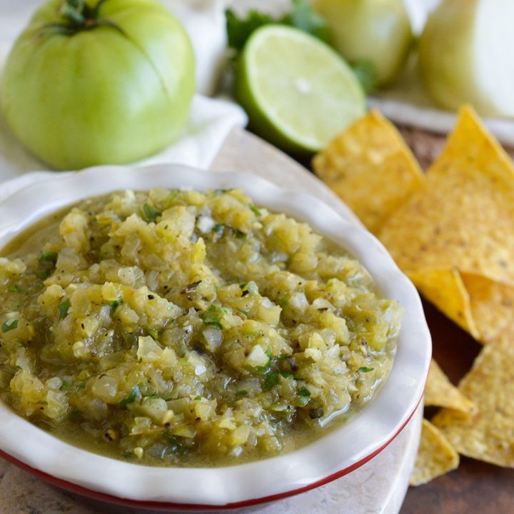 This Grilled Green Tomato Salsa Recipe is perfect for using up those green tomatoes! An easy green salsa verde with a smoky grilled flavor. The perfect summertime appetizer!