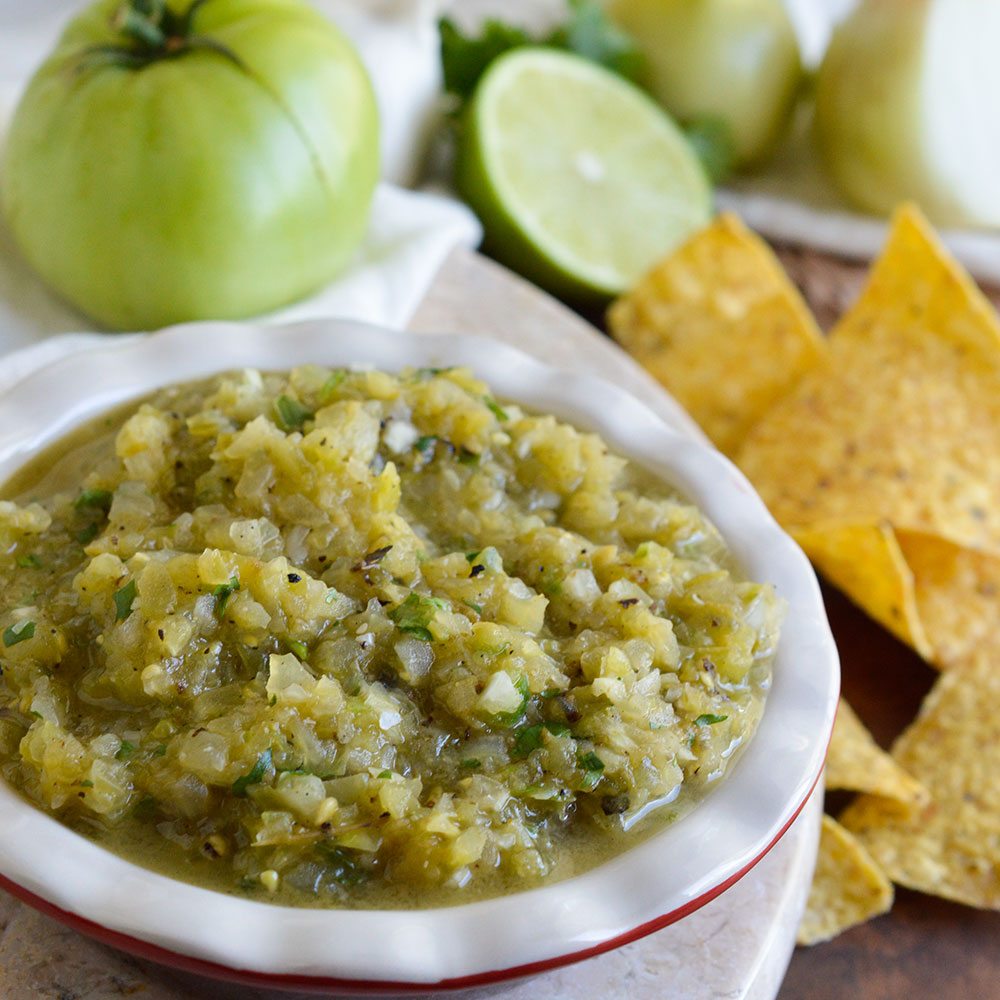 This Grilled Green Tomato Salsa Recipe is perfect for using up those green tomatoes! An easy green salsa verde with a smoky grilled flavor. The perfect summertime appetizer!