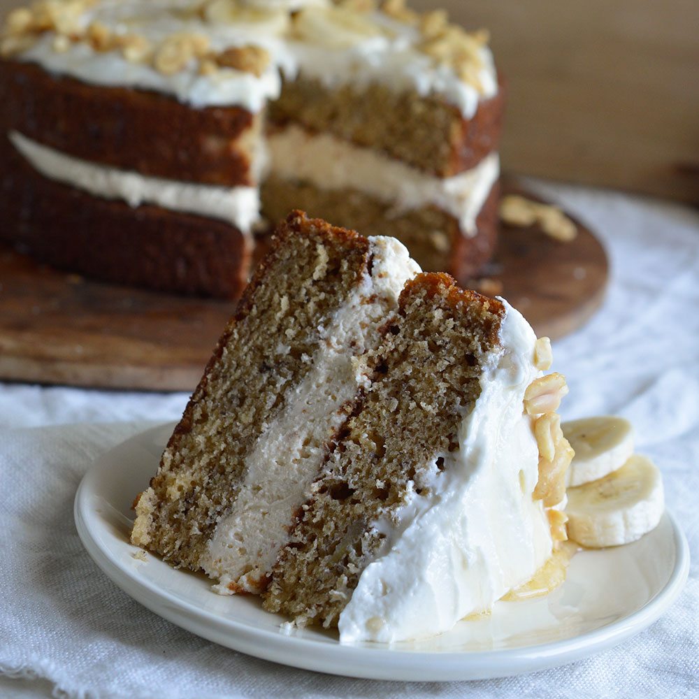 Banana Layer Cake with Peanut Butter and Honey Frosting. This fun and easy naked layer cake will take you back to your childhood! The perfect blend of peanut butter, honey and banana in one impressive dessert recipe!