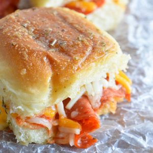 These Oven Baked Pepperoni Pizza Sandwiches are the perfect game day recipe! Quick, easy and guaranteed to be a crowd favorite!