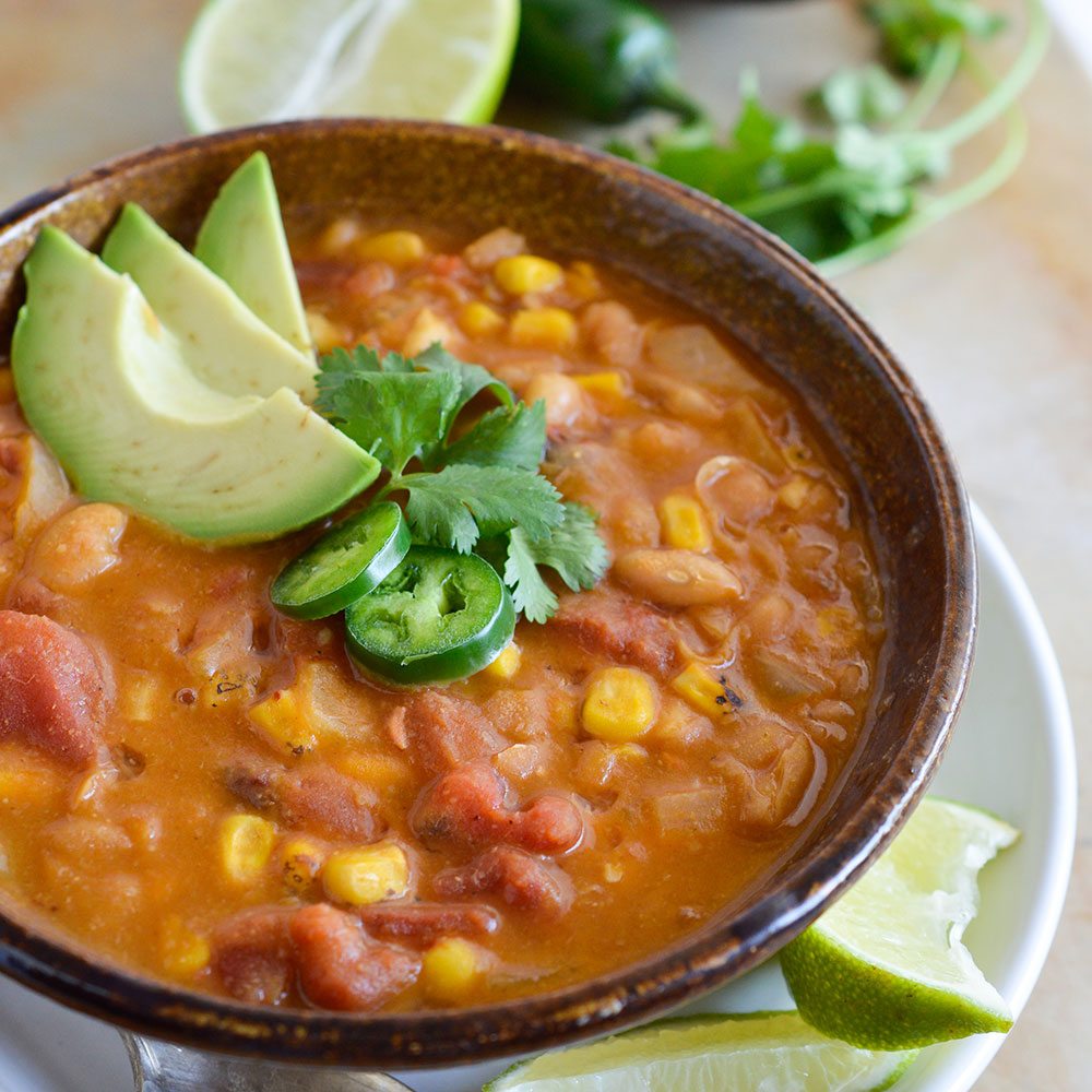 This One-Pot White Bean Vegan Chili Recipe is great for Meatless Monday or as a meat free game day option. All the flavor of a thick chili without any meat!