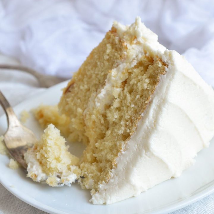 Bake a cake just like Grandma used to with this Vintage Buttermilk Vanilla Cake Recipe From Scratch. A delicate layer cake topped with homemade vanilla buttercream frosting!