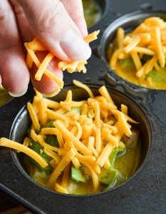 These Cheesy Avocado Egg Muffins are great for feeding a hungry breakfast or brunch crowd! All your favorite breakfast ingredients in one bite sized vegetarian egg muffin.