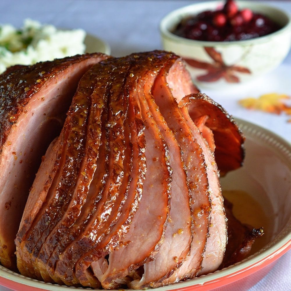 Pineapple Honey Glazed Ham Recipe - This is a simple and delicious holiday meal! A flavorful glaze made with pineapple juice, dijon mustard and honey for your spiral ham..