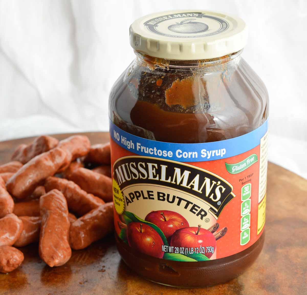 Apple Barbecue Slow Cooker Little Smokies are the perfect holiday appetizer! Mini sausages cooked in your crockpot and slathered with a mild, sweet sauce.