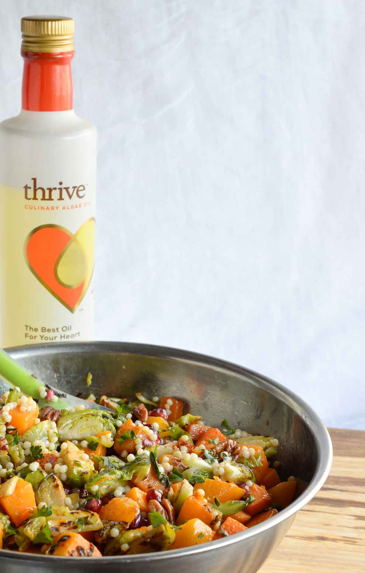 Butternut Squash Pasta Salad is a healthy holiday side dish! This vegan recipe is full of fresh winter produce: butternut squash, brussels sprouts, pomegranate seeds, pecans and pasta. All topped with fresh orange and maple dijon vinaigrette!