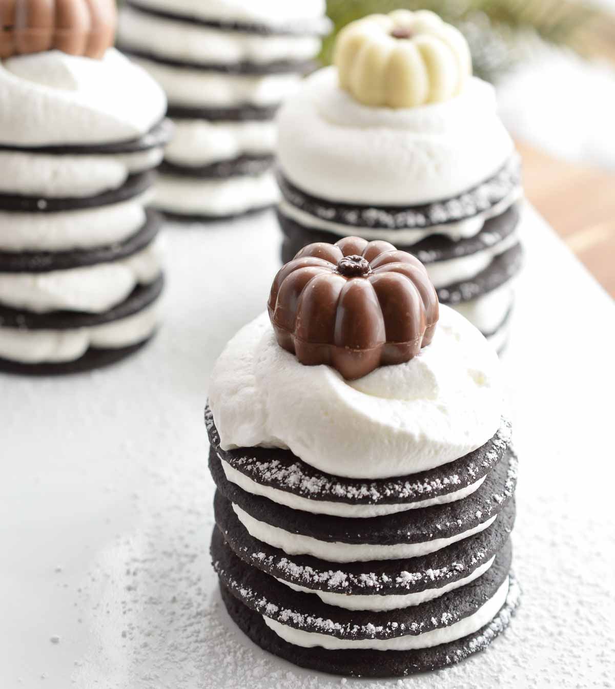 For the perfect Thanksgiving dessert make these Chocolate Pumpkin Spice Ice Box Cakes with wafers and whipped cream. This easy, make ahead recipe will be a holiday hit!