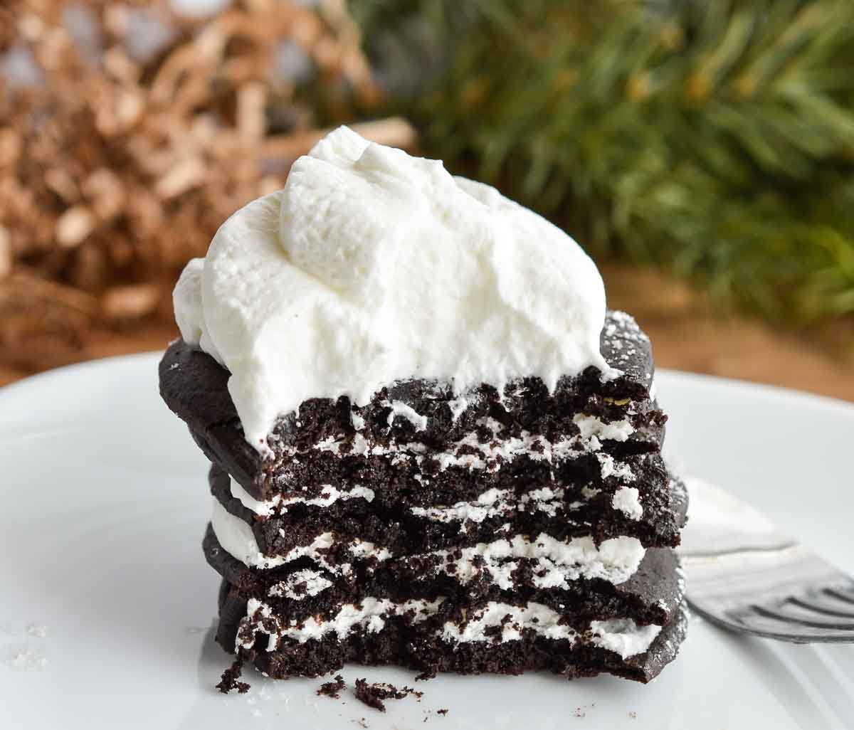 For the perfect Thanksgiving dessert make these Chocolate Pumpkin Spice Ice Box Cakes with wafers and whipped cream. This easy, make ahead recipe will be a holiday hit!