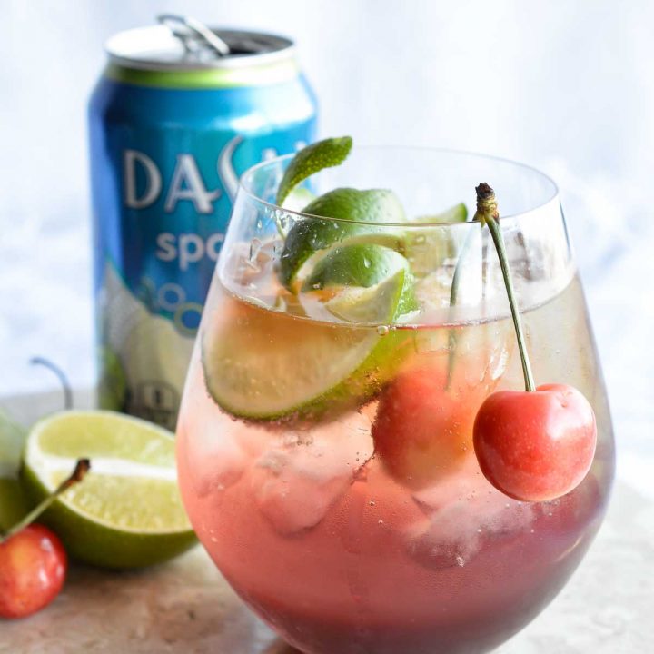 This Shirley Temple Cocktail Recipe is an easy and refreshing party drink. Also known as a Dirty Shirley; a blend of cherry, lime, rum or vodka and fizzy sparkling Dasani.