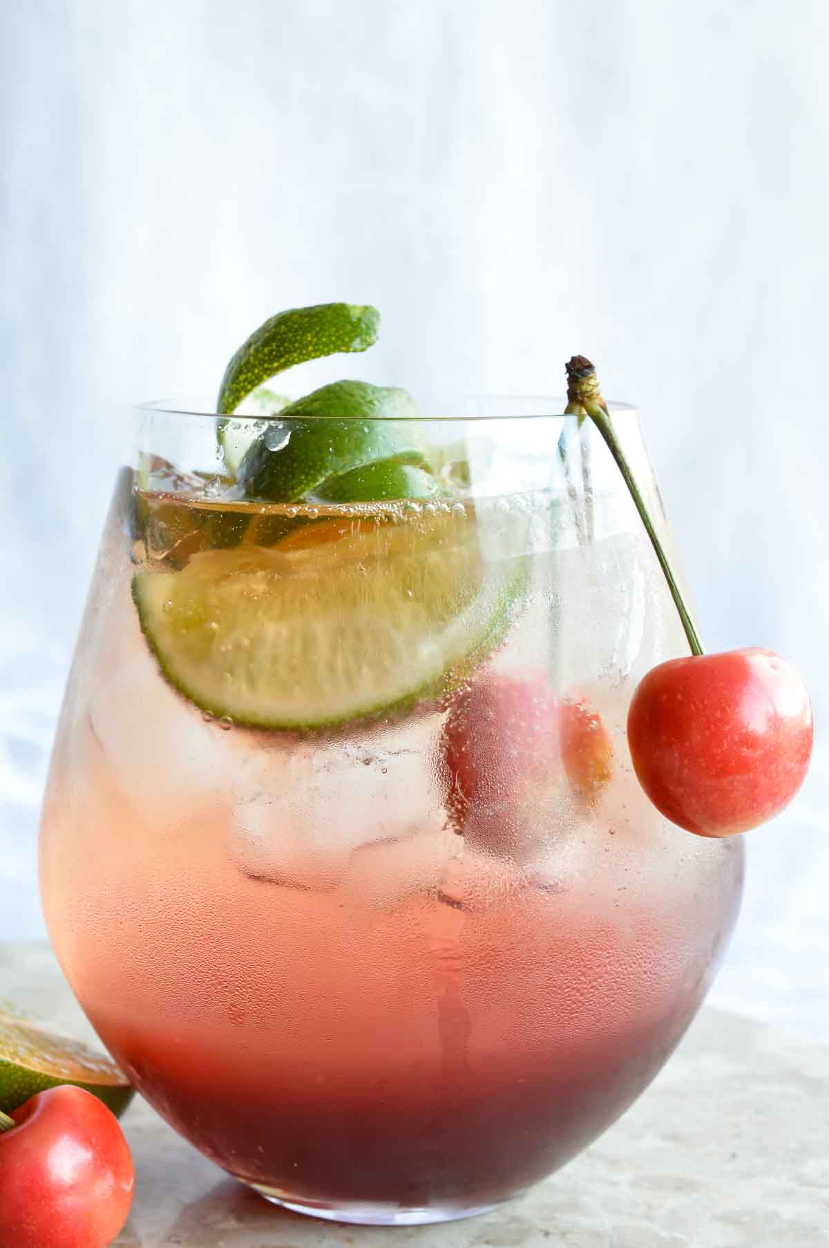 This Shirley Temple Cocktail Recipe is an easy and refreshing party drink. Also known as a Dirty Shirley; a blend of cherry, lime, rum or vodka and fizzy sparkling Dasani.