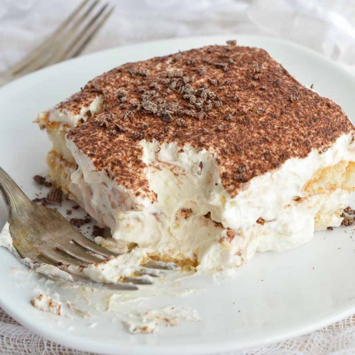 This Easy Tiramisu Recipe is perfect for any occasion! Ladyfingers soaked in Baileys and coffee then layered with mascarpone whipped cream. It will be your new favorite dessert!