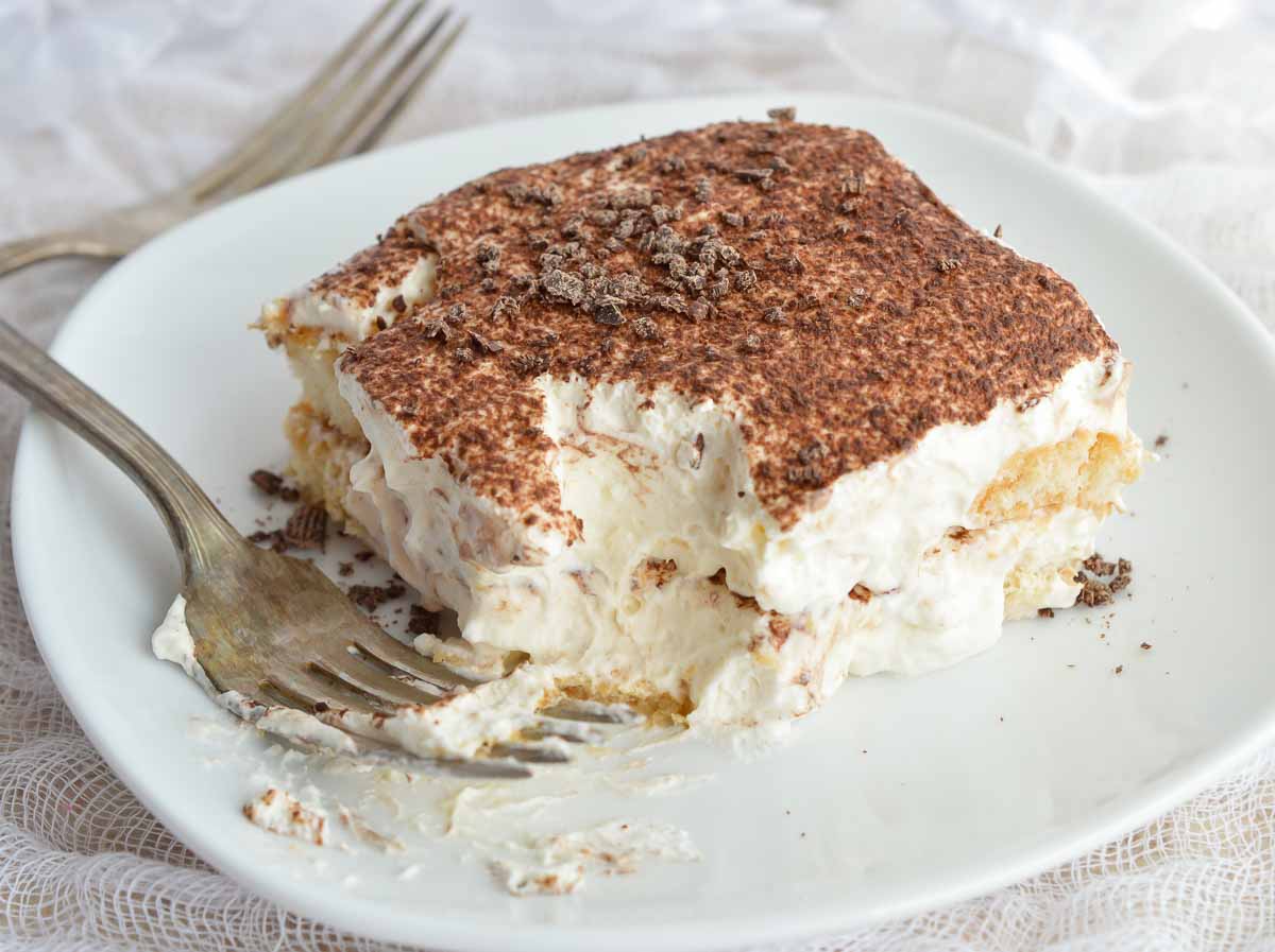 This Easy Tiramisu Recipe is perfect for any occasion! Ladyfingers soaked in Baileys and coffee then layered with mascarpone whipped cream. It will be your new favorite dessert!