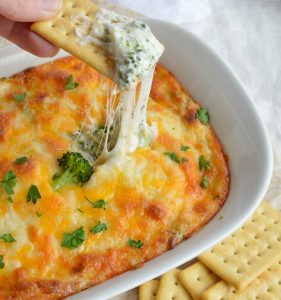 This Broccoli Cheese Dip Recipe is an easy and unique appetizer. Perfect for parties, holiday feasts and game day grub!