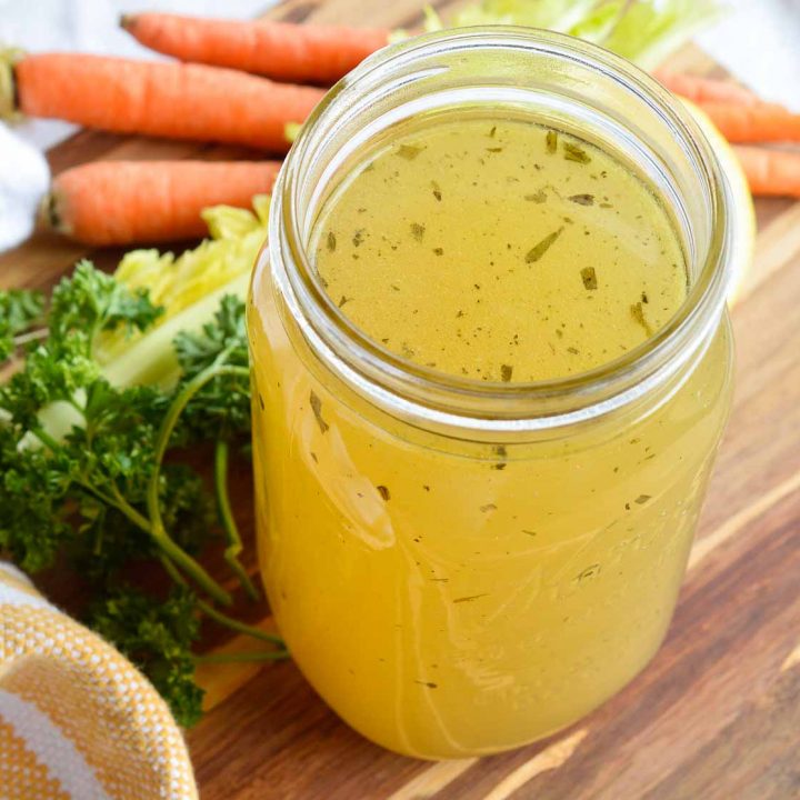 This Homemade Chicken Stock Recipe is so flavorful and easy to make. Just toss the ingredients into your slow cooker and forget about it. 12 hours later you have the most amazing chicken broth just waiting to be used!