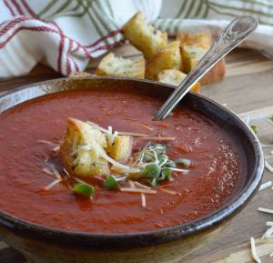 This Easy Tomato Soup Recipe is comfort food at it's best. San Marzano Tomatoes and roasted garlic take this family favorite to the next level! Enjoy a bowl of this healthy homemade soup for lunch or dinner.