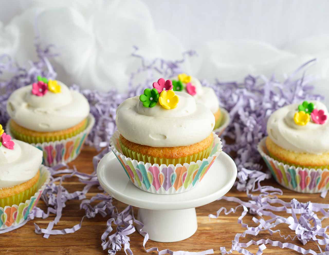 This Vanilla Cream Cheese Frosting Recipe is perfect for just about any cake. Cream cheese whipped into buttercream icing and flavored with vanilla. Make these Spring cupcakes for a tasty Easter treat!