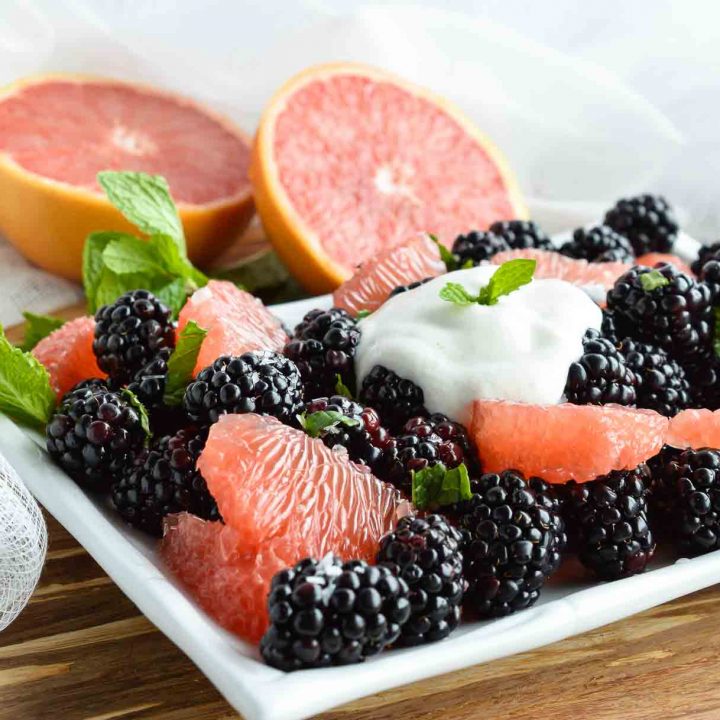 Start your day with this Easy Fresh Fruit Salad Recipe. A simple combination of sweet blackberries, tangy grapefruit, fresh mint and creamy Greek yogurt. The perfect healthy breakfast, snack or side dish!