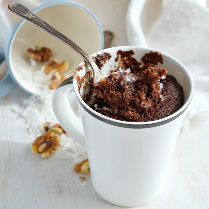 Craving chocolate and need a quick dessert fix? This Egg-Free, Dairy-Free German Chocolate Mug Cake Recipe is the solution! You read that right. No eggs. No dairy. And this vegan chocolate cake is made in 5 minutes!