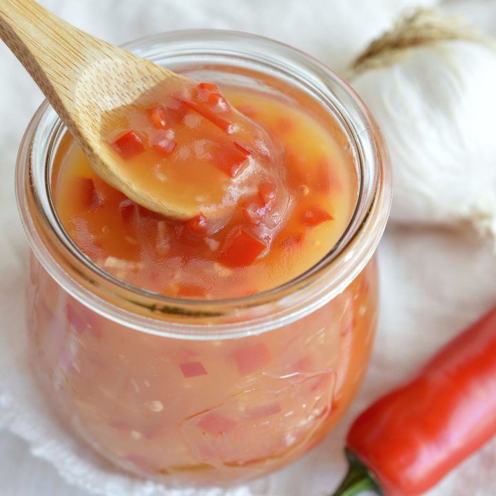 Inspired by sauce from my favorite Chinese food restaurant this Sweet Chili Sauce Recipe tastes great on just about anything! Slather it on any type of meat, use it in stir fry or as an egg roll dip. I took my sauce out to the barbecue and made Grilled Shrimp and Pineapple Skewers!