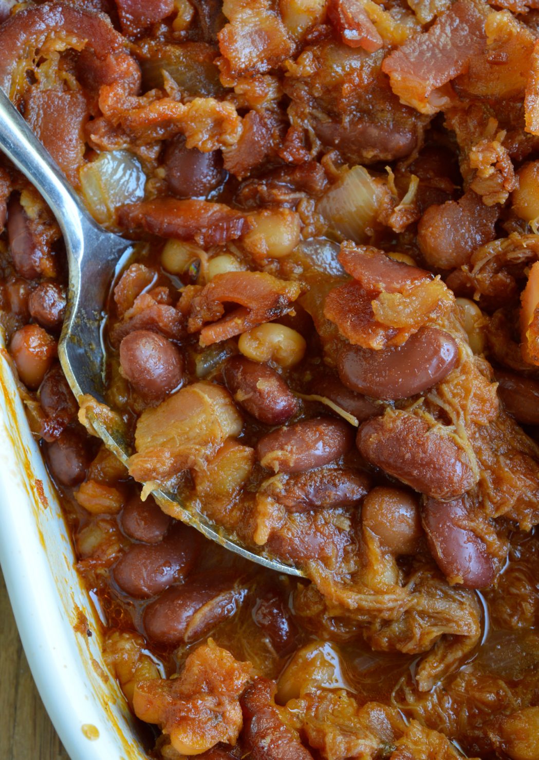 The pulled pork and bacon in this Double Pork Baked Beans Recipe makes it perfect as a side dish or dinner! Homemade pork and beans is super easy and delicious. This dish is great for feeding a hungry crowd!
