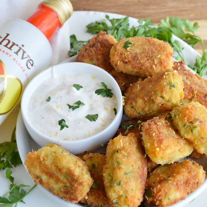 With the end of summer comes an abundance of fresh zucchini. Try this Cheesy Zucchini Tater Tots Recipe and that zucchini will be gone in no time! Cheese, zucchini and potatoes fried up into homemade tater tots.