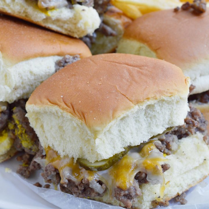 These Oven Baked Mini Burgers are inspired by my favorite fast food, White Castle and Krystal Burgers. This copycat recipe of my ultimate craving is perfect for feeding the family or a large crowd on game day! Don't forget the fries and sweet tea!