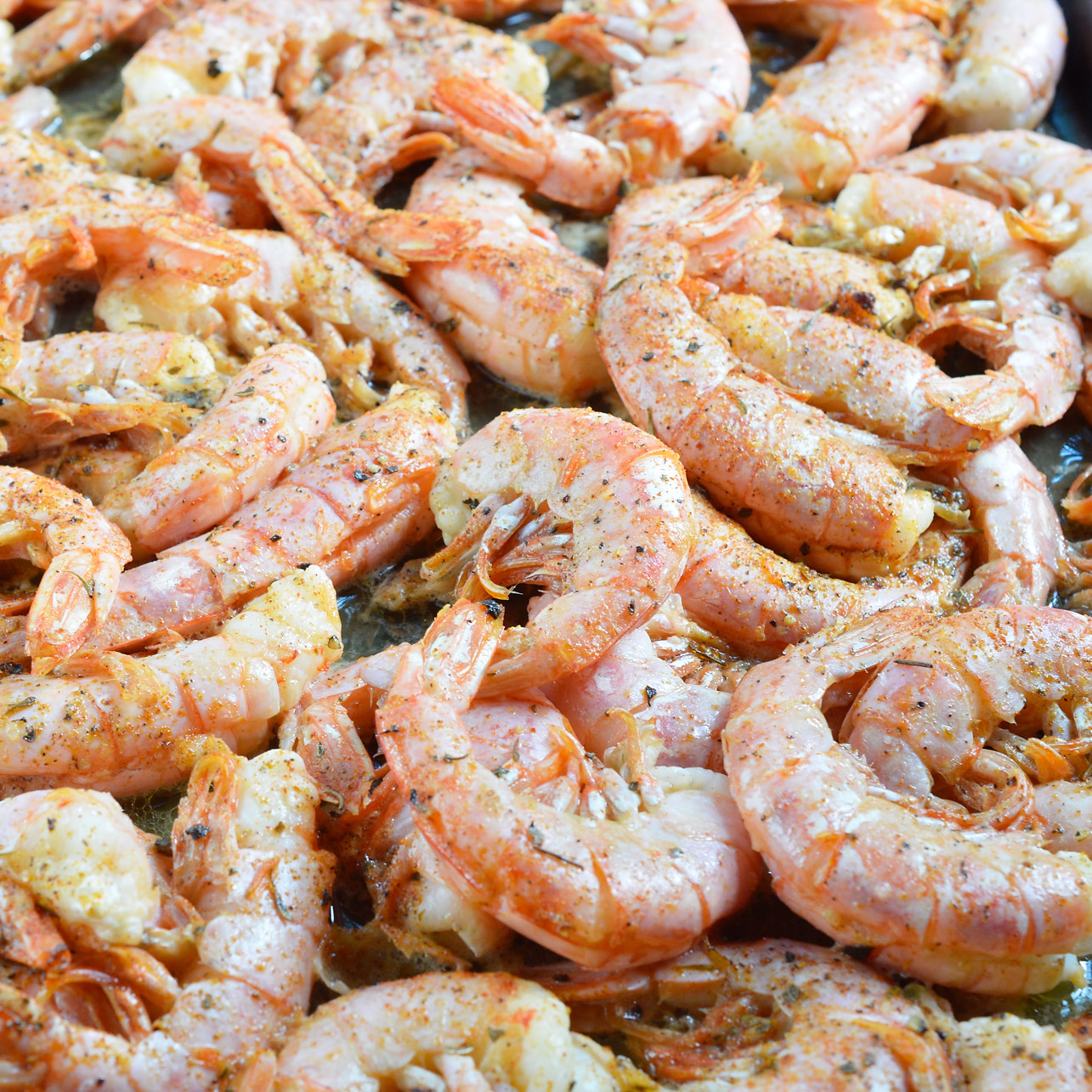 Oven Roasted Shrimp is quick, simple and delicious! This dinner or appetizer is swimming in butter, lemon and spices. Ready in 10 minutes!