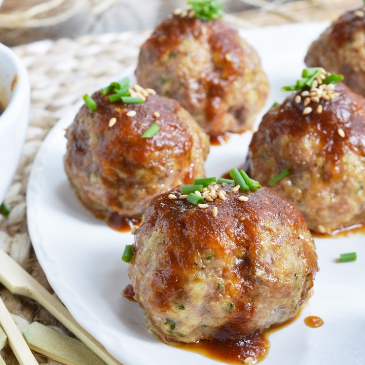 These Saucy Asian Meatballs are perfect for parties! This easy appetizer recipe is a combo of baked meatballs and a sweet ginger sauce that takes just 10 minutes to make.