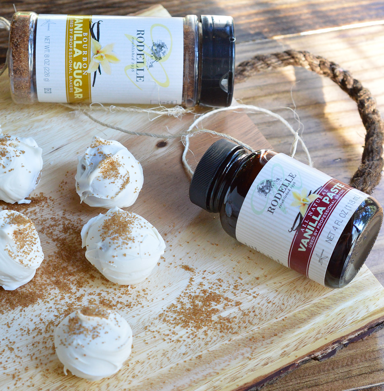 Another great no-bake holiday dessert! This Vanilla Cookie Balls Recipe is perfect for those folks that aren't all about the chocolate. Vanilla wafer, cream cheese and vanilla bean paste formed into balls then coated with white candy and bourbon vanilla sugar!